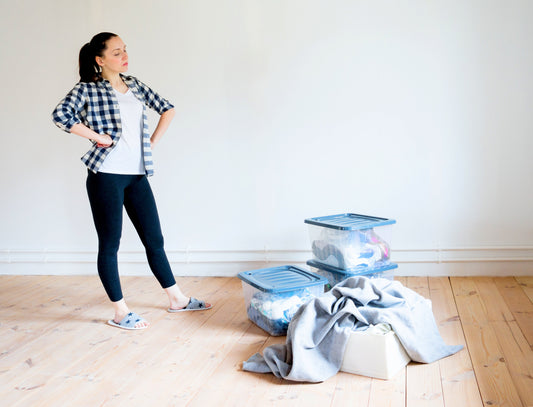 person looking at clutter to organize